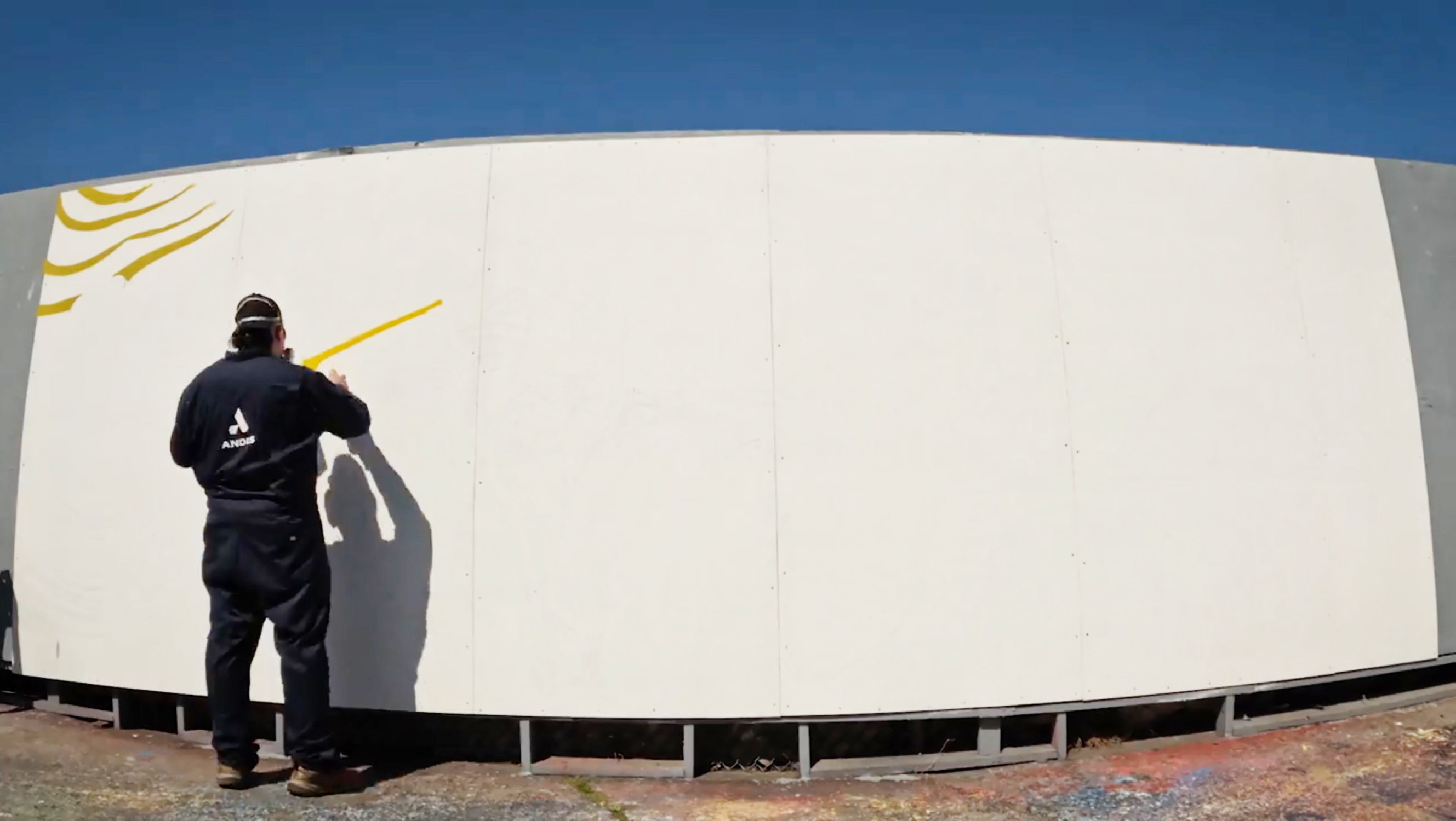 Brighter Community Venice Beach man in front of blank wall painting