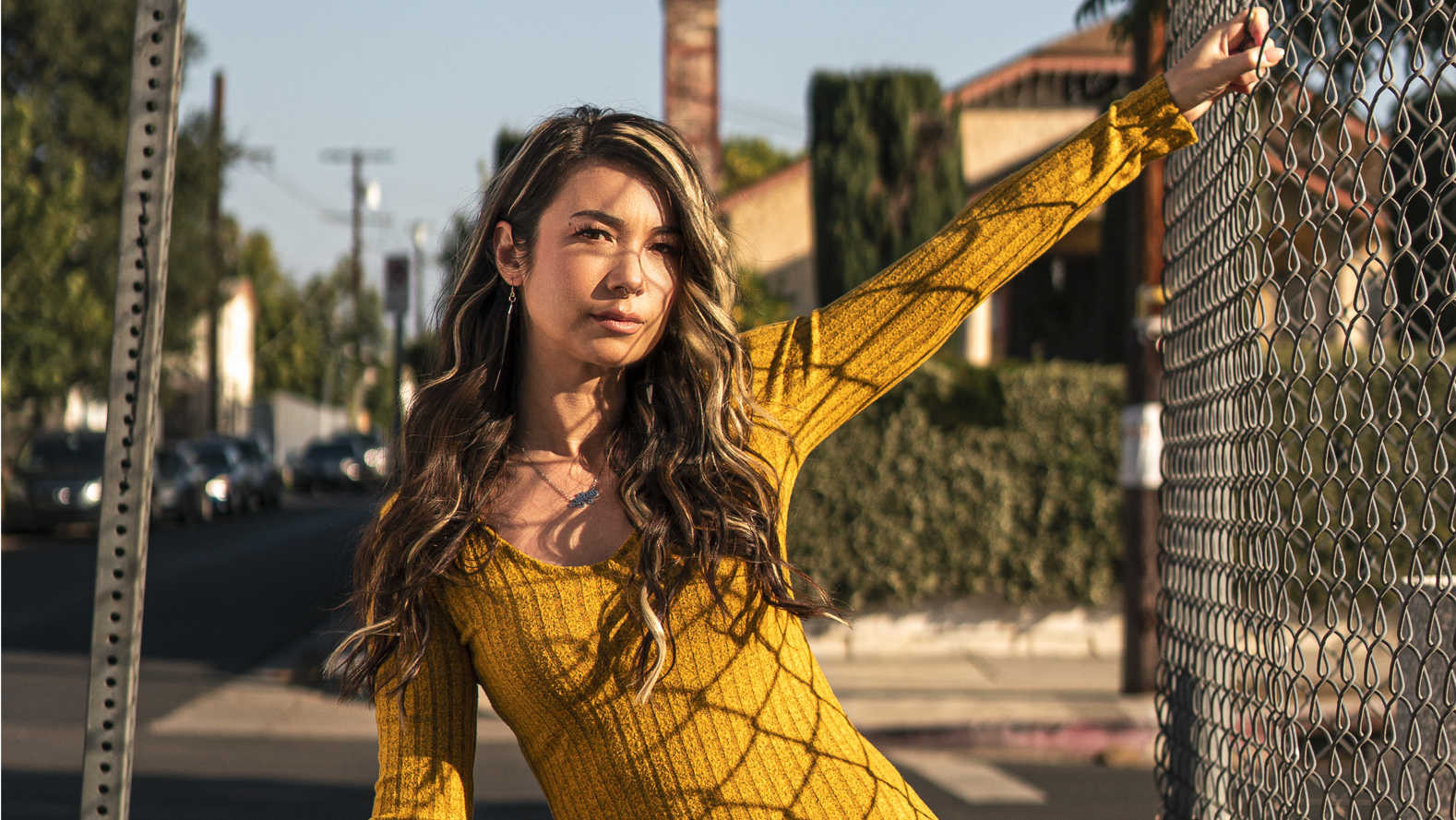 Vanessa Rene next to chain link fence