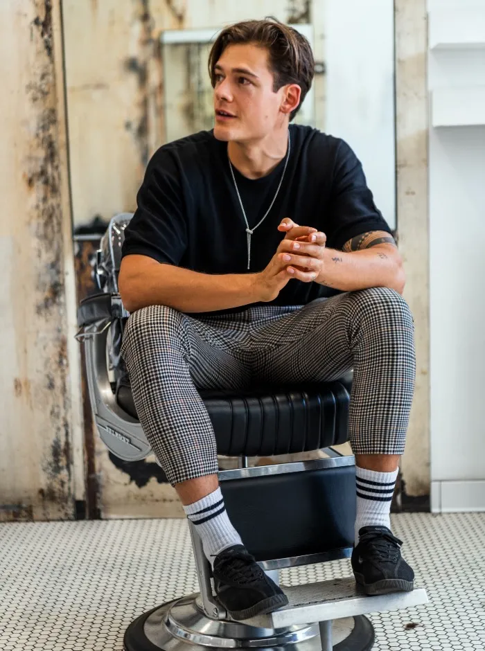 Large image of man sitting in barber chair